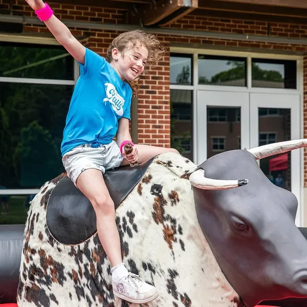 Mechanical bull ride rental at an outdoor event