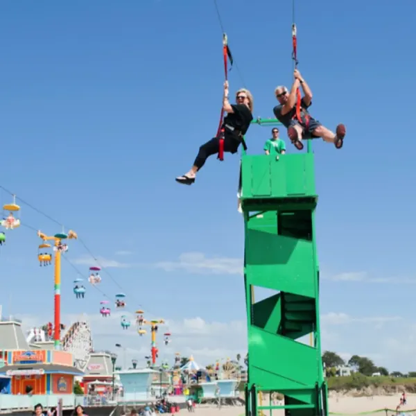 Rock climbing wall and bungee jump attraction